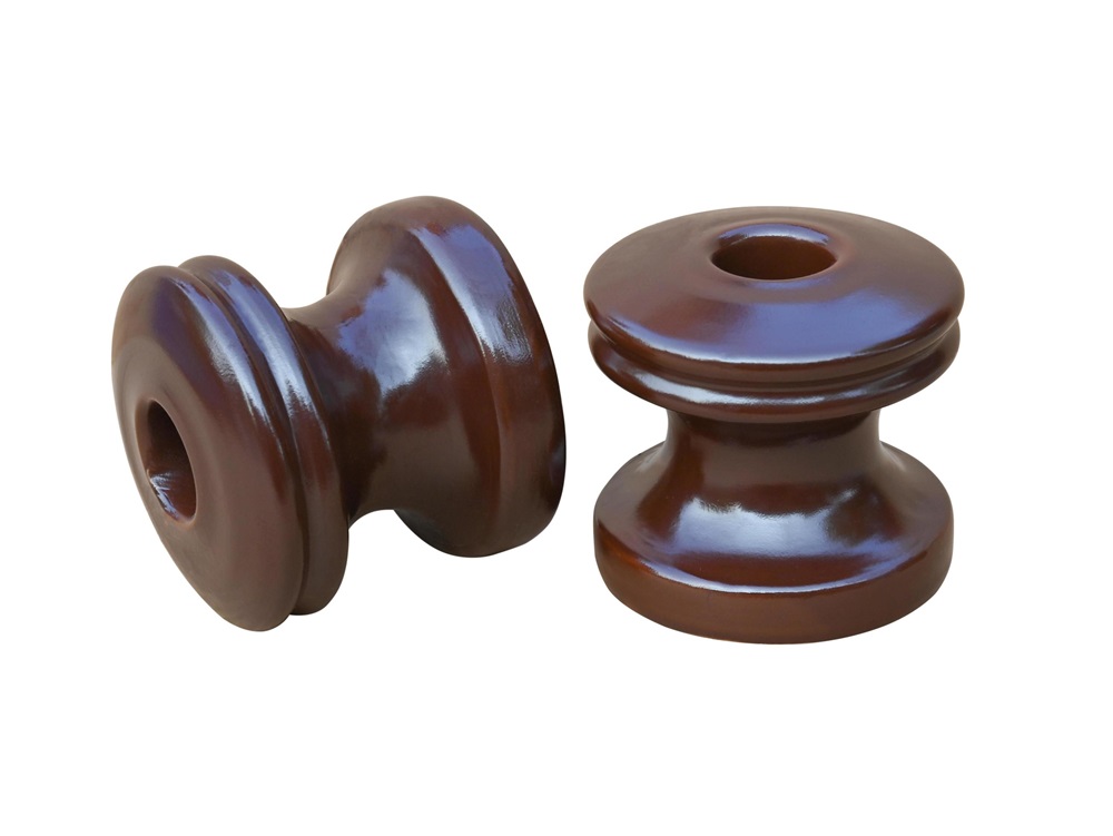 Shackle insulators isolate live conductors from structures