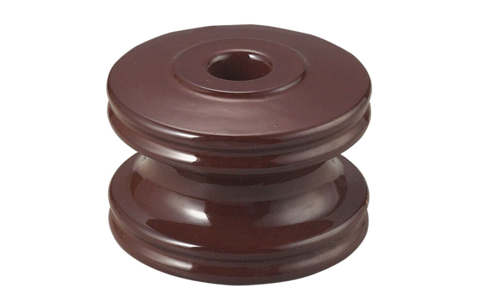 Spool insulators hold wires and conductors in place